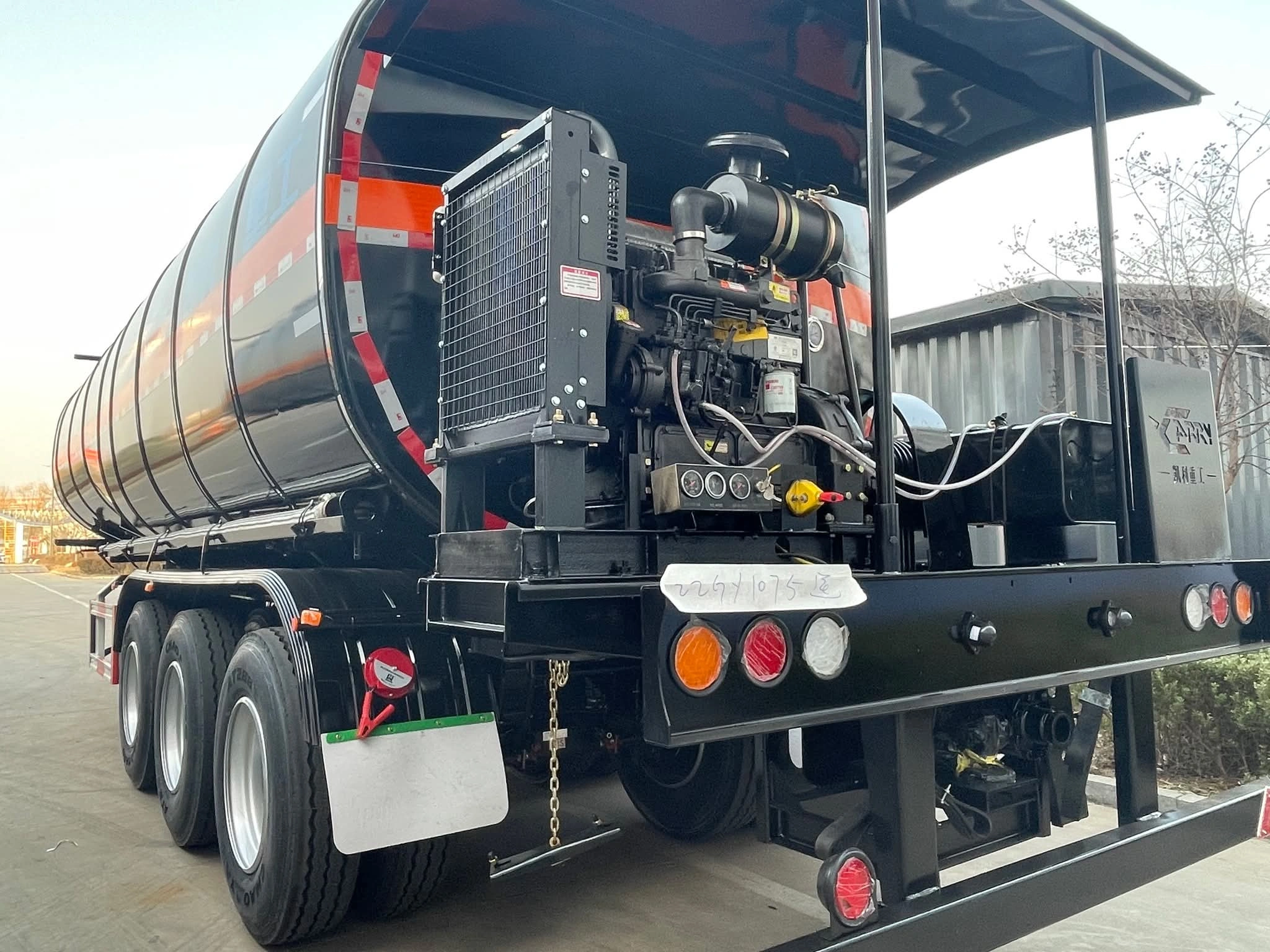Heating and auxiliary equipment area on the three-axle asphalt tanker